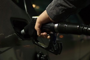 person filling up gas tank