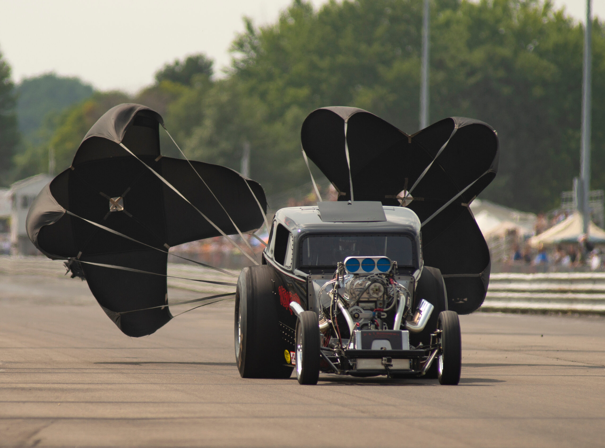 Dragster Deploys Chutes after Racing Run at the Drag Strip