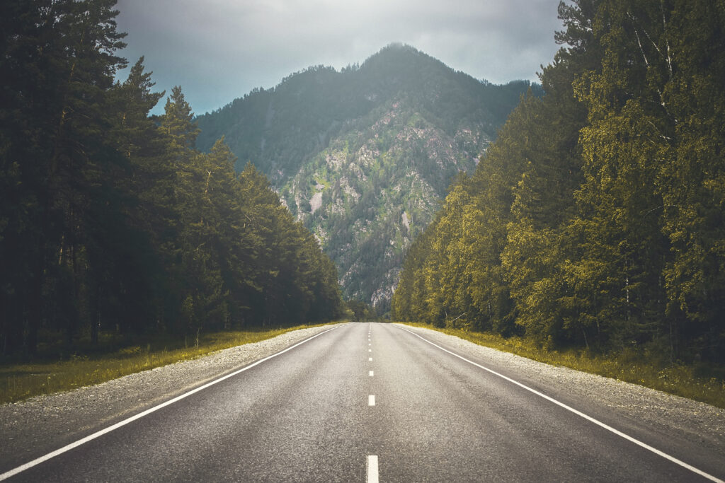 A long country road, overcast. 