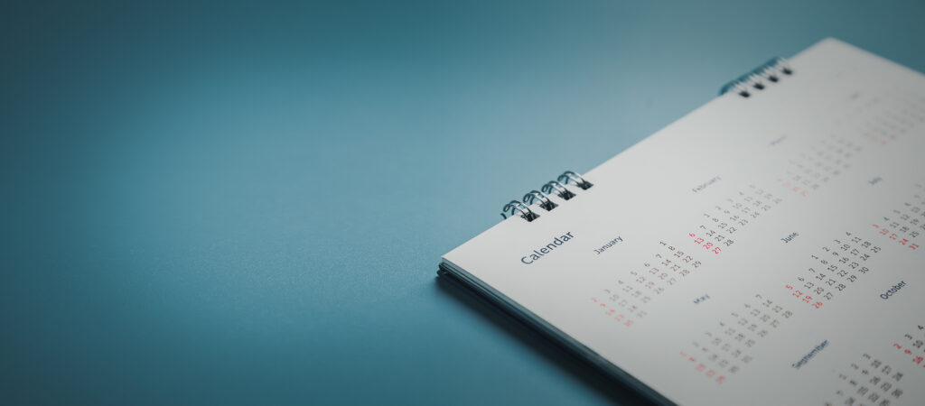 A calendar on a blue backdrop.