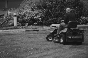 man riding lawn mower
