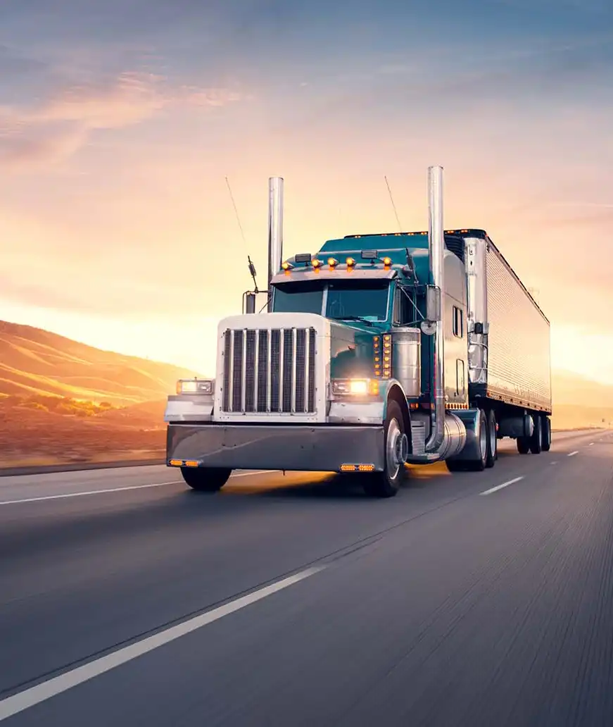 Close up of semi truck driving down highway